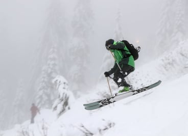 Skier sending it down Wildside at Summit West on Opening Day
