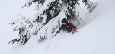 Skier in deep April powder at Alpental