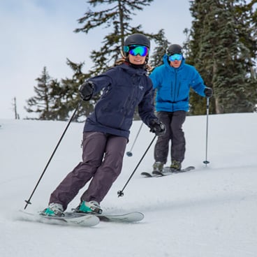 Couple Skiing at The Summit